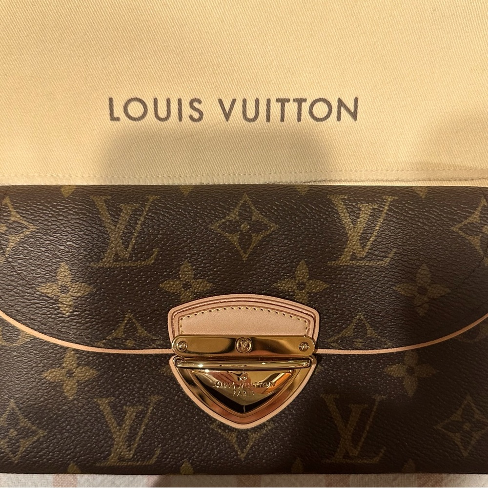 Authentic Louis Vuitton Eugenie Wallet. Monogram brown coated canvas.